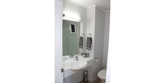 clean bathroom with a range of toiletries for guests use